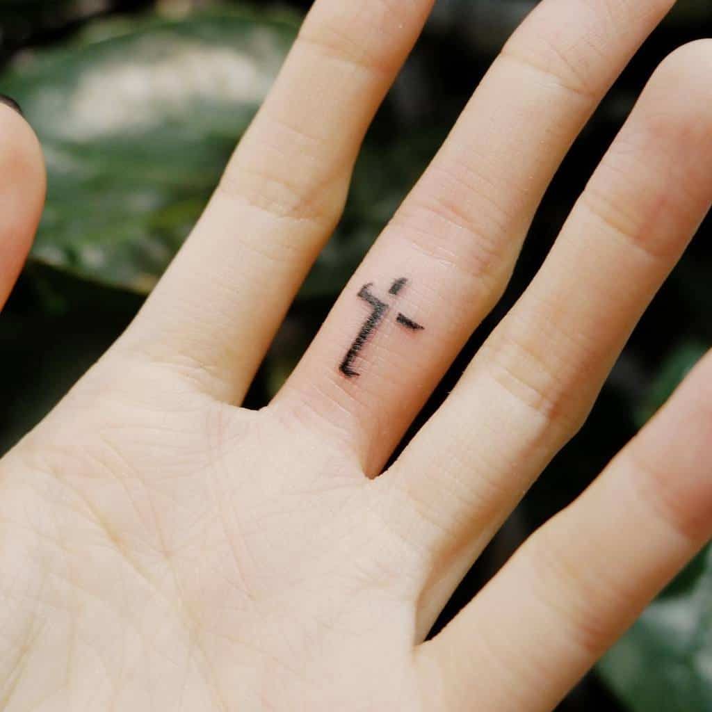 Small Cross Hand Finger Tattoo ching.tattoo